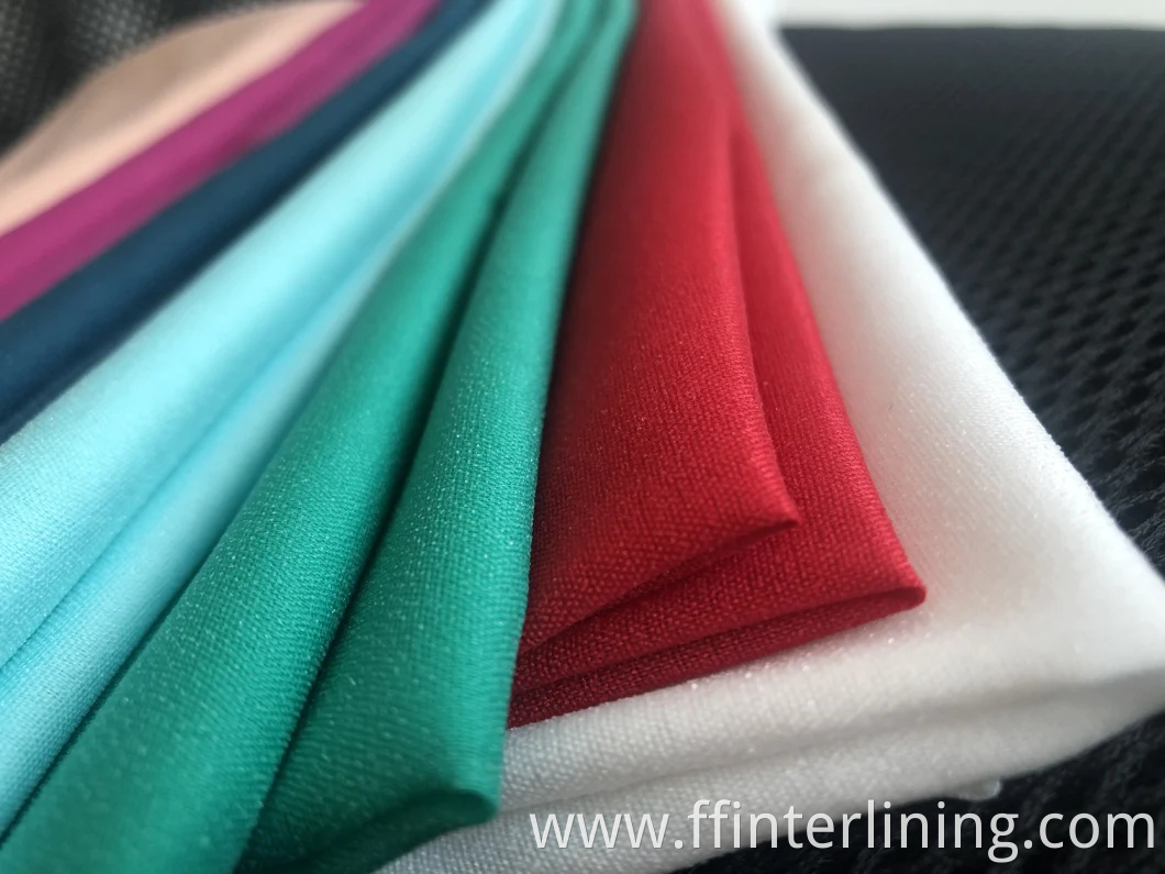 High Quality 100% Polyester Woven Interlining Supplier High Quality Woven Fusible Fabric Color Interlining 30d 50d 75D